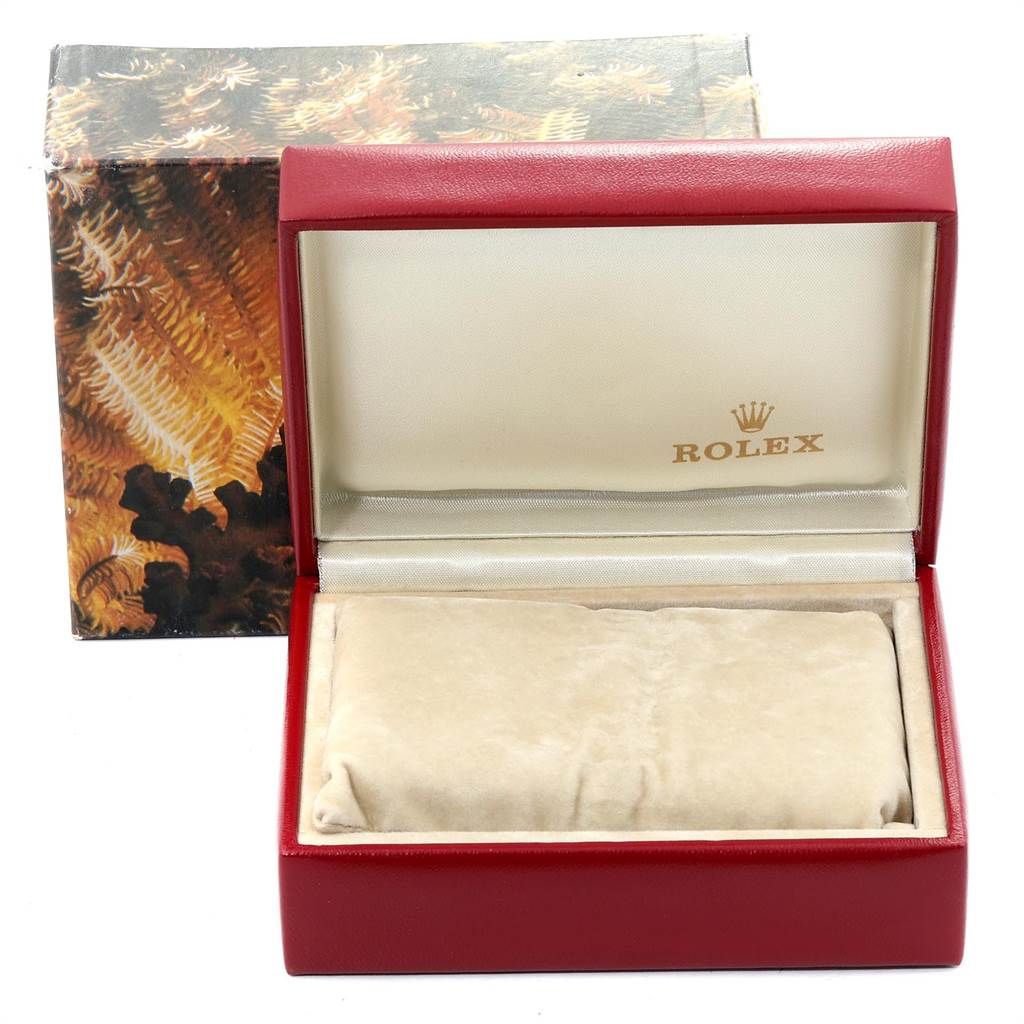 This image shows a Rolex President 69278 Women's Yellow Gold Blue Dial 69278 Women's Yellow Gold Blue Dial model watch box, open to reveal a beige cushion inside.