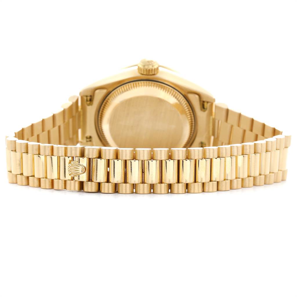 The image shows the back case and bracelet of a gold Rolex President 69238 Women
s Yellow Gold Champagne Dial 69238 Women
s Yellow Gold Champagne Dial model watch, viewed from behind.