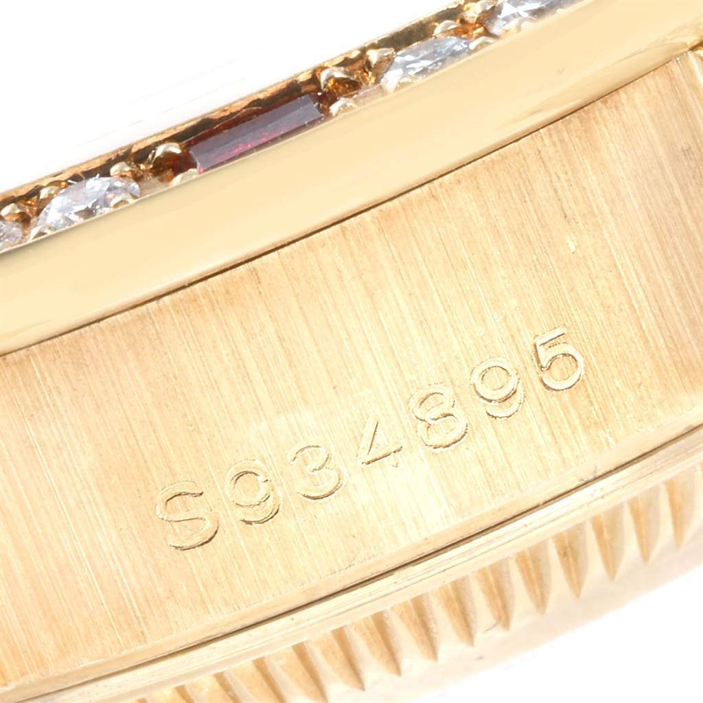 This image shows a close-up view of the serial number and part of the bezel of a Rolex President 69238 Women
s Yellow Gold Champagne Dial 69238 Women
s Yellow Gold Champagne Dial model watch.