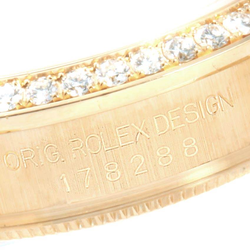 This close-up image shows the engraved inner bezel of a Rolex President 178288 Women's Yellow Gold Mother of Pearl Dial 178288 Women's Yellow Gold Mother of Pearl Dial model watch.