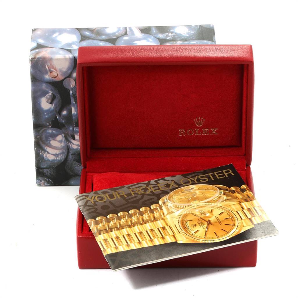 The image shows a Rolex President 69178 Women's Yellow Gold Champagne Dial 69178 Women's Yellow Gold Champagne Dial model watch box and manual placed at an angle.