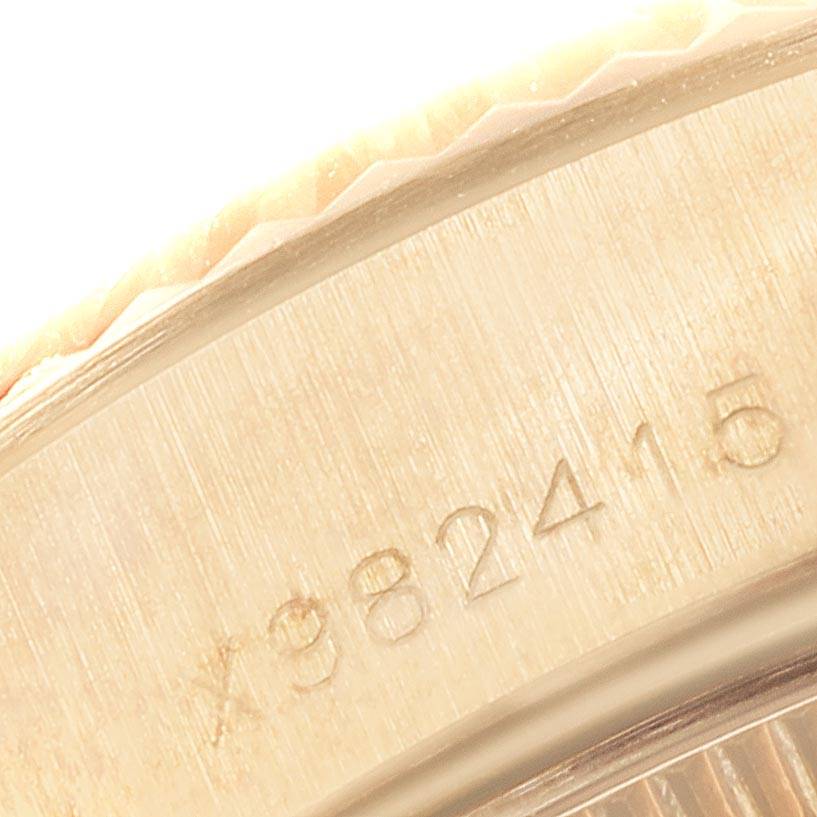 This image shows a close-up of the case edge and serial number of a Rolex President 69178 Women's Yellow Gold Champagne Dial 69178 Women's Yellow Gold Champagne Dial model watch.