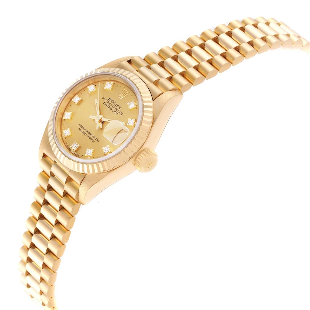 This is a Rolex President 69178 Women's Yellow Gold Champagne Dial 69178 Women's Yellow Gold Champagne Dial model watch shown at a tilted angle, displaying the dial, bezel, crown, and the bracelet band.