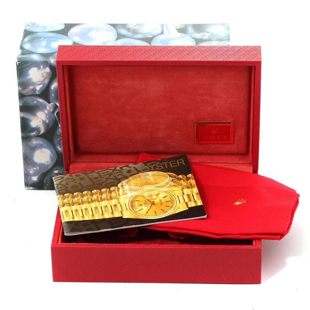 The image shows a red Rolex President 68149 Women's White Gold Beige Dial 68149 Women's White Gold Beige Dial watch box, a booklet with the watch image, and a red cloth, from a front angle.