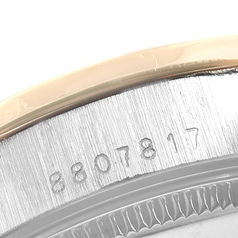 This image shows a close-up of the serial number engraved on the case back edge of a Rolex President 68149 Women's White Gold Beige Dial 68149 Women's White Gold Beige Dial model watch.
