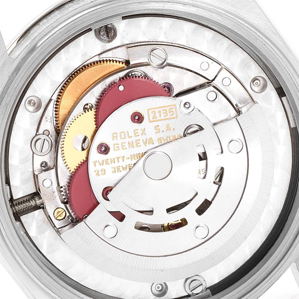 Close-up view of the inner movement and mechanism of a Rolex President 68149 Women's White Gold Beige Dial 68149 Women's White Gold Beige Dial watch, showing gears and components.