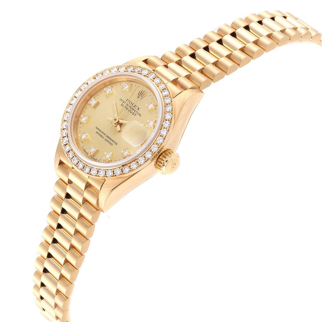 The image shows a side angle of the Rolex President 69138 Women
s Yellow Gold Champagne Dial 69138 Women
s Yellow Gold Champagne Dial model, highlighting the bezel, crown, and bracelet.
