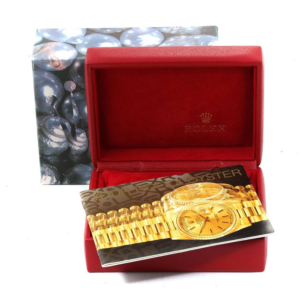 This image shows a Rolex President 69138 Women's Yellow Gold Champagne Dial 69138 Women's Yellow Gold Champagne Dial model watch box and an accompanying booklet, photographed from the front angle.