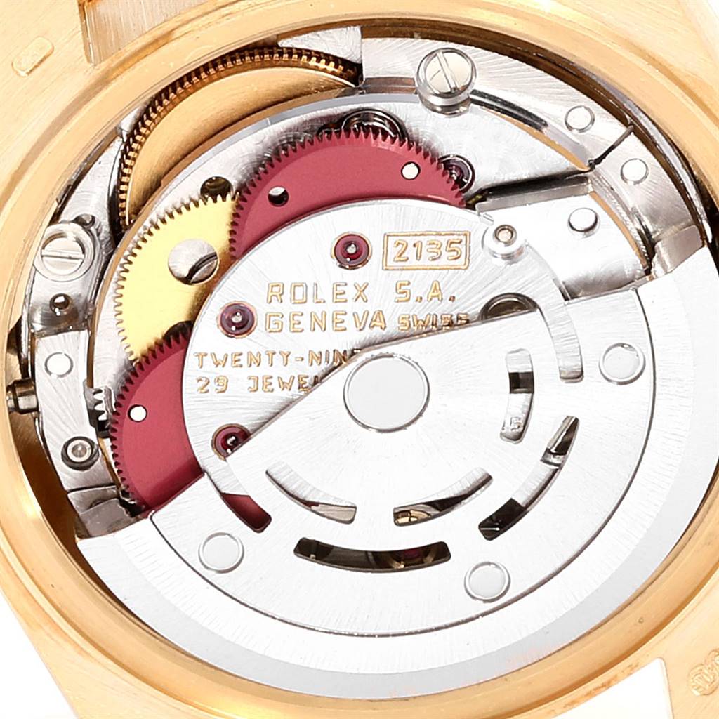 This is an internal view of the Rolex President 69138 Women's Yellow Gold Champagne Dial 69138 Women's Yellow Gold Champagne Dial model watch, showing the intricate mechanics and gears of its movement.