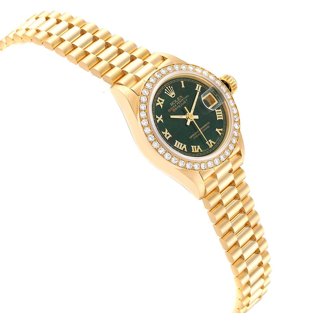 The image shows a Rolex President 69138 Women's Yellow Gold Champagne Dial 69138 Women's Yellow Gold Champagne Dial model watch at an angled side view, highlighting its gold bracelet and diamond-encrusted bezel.