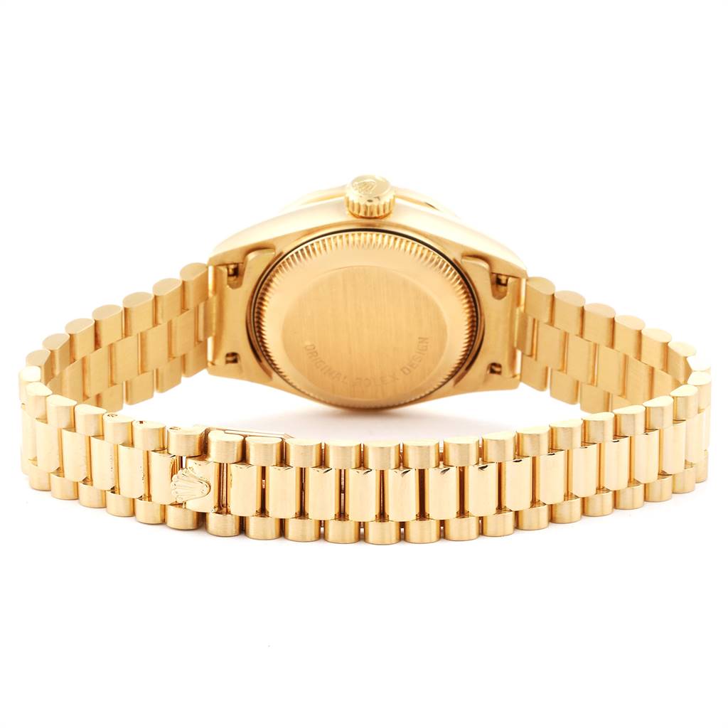 This image shows the back view of a Rolex President 69138 Women's Yellow Gold Champagne Dial 69138 Women's Yellow Gold Champagne Dial model watch, featuring the case back and President bracelet.
