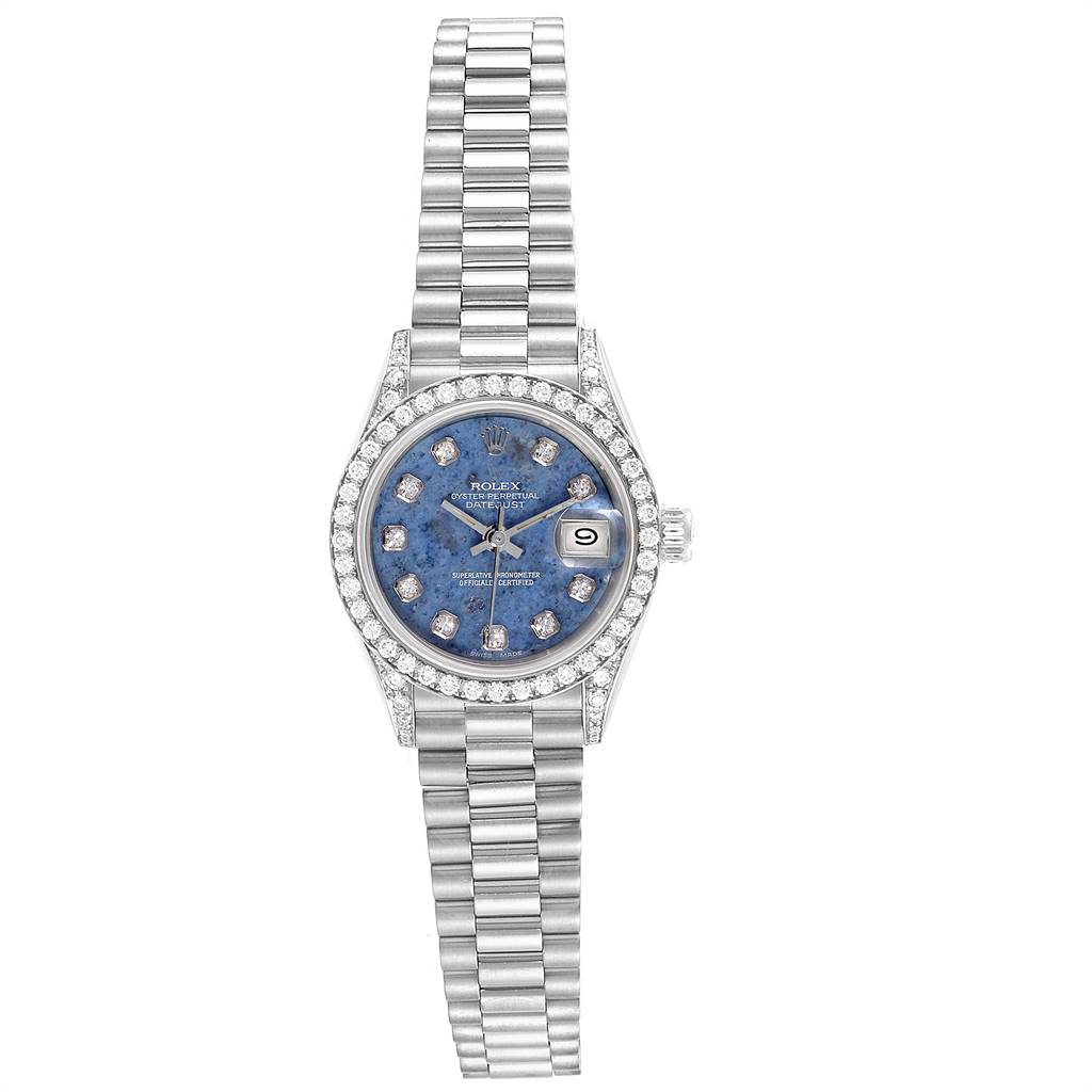 The image shows a Rolex President 69159 Women's White Gold Blue Dial 69159 Women's White Gold Blue Dial model watch, featuring a blue dial, diamond hour markers, and a silver bracelet from a top-down angle.
