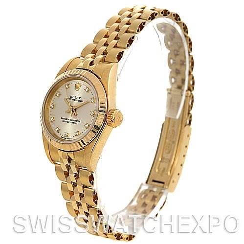 The image shows a side angle of a Rolex President 67197 Women's Yellow Gold Silver Dial 67197 Women's Yellow Gold Silver Dial model watch, highlighting the dial, bezel, crown, and bracelet.