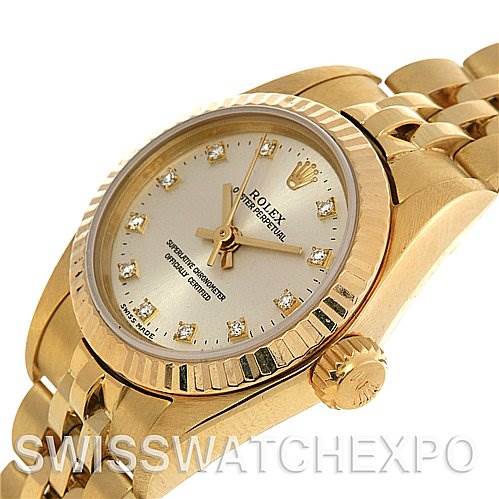 The image shows a close-up, angled view of a Rolex President 67197 Women's Yellow Gold Silver Dial 67197 Women's Yellow Gold Silver Dial model watch, focusing on the dial, crown, and part of the bracelet.