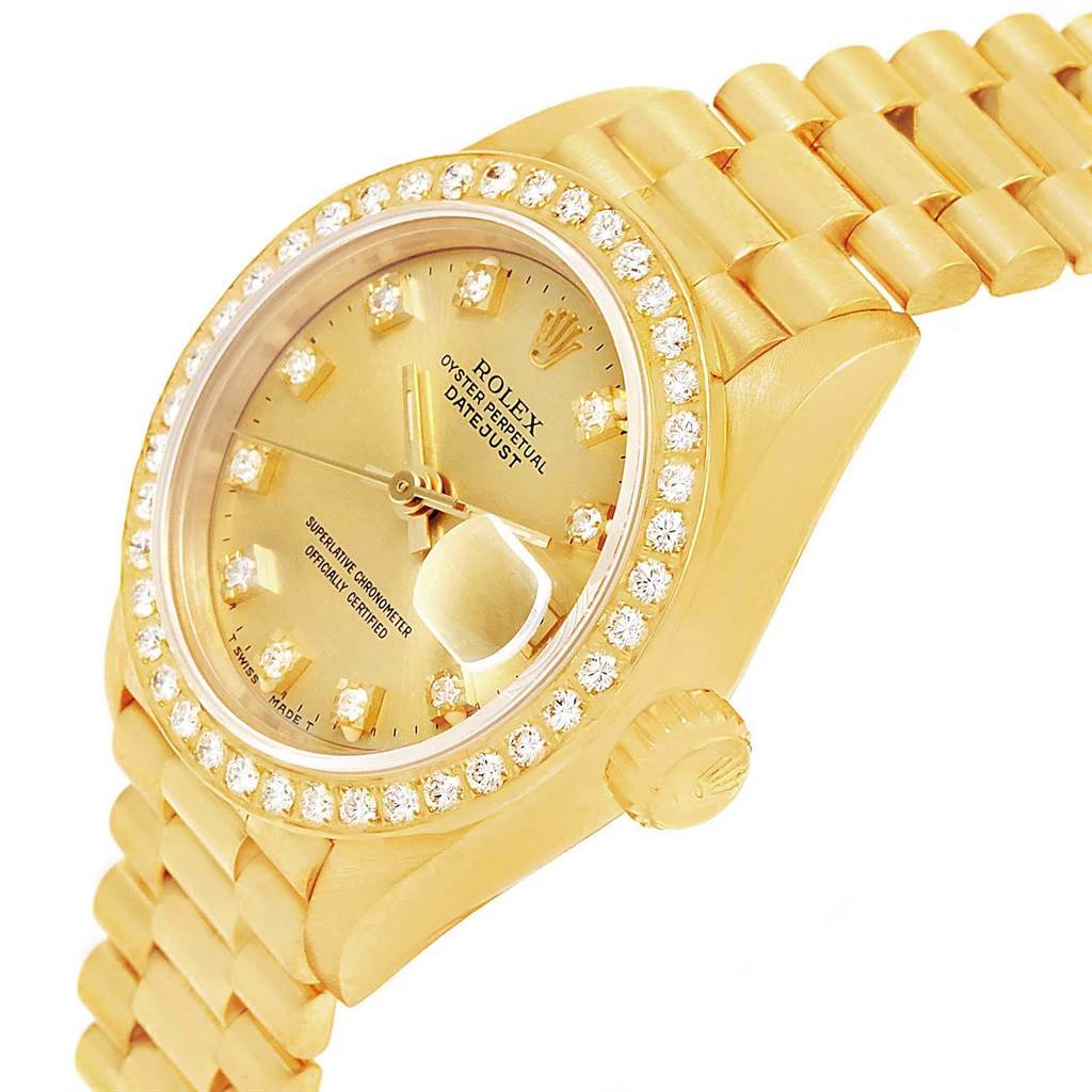 The Rolex President 69178 Women's Yellow Gold Champagne Dial 69178 Women's Yellow Gold Champagne Dial model watch is shown from a slightly angled view, highlighting its gold bracelet, diamond bezel, and dial.