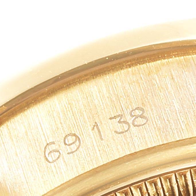 The image shows a close-up of the model number "69138" engraved on the bezel of a Rolex President 69138 Women's Yellow Gold Blue Dial 69138 Women's Yellow Gold Blue Dial watch.