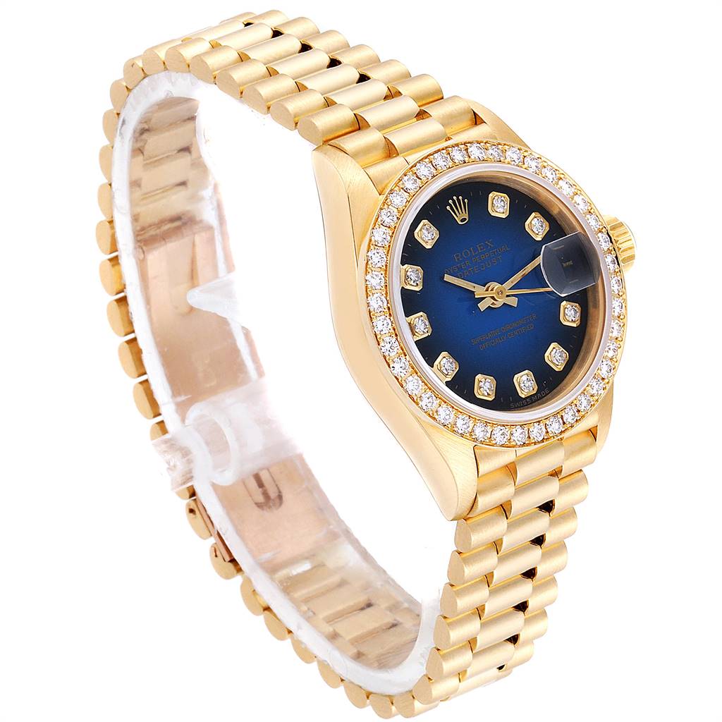The image showcases a Rolex President 69138 Women's Yellow Gold Blue Dial 69138 Women's Yellow Gold Blue Dial model watch at an angled view, highlighting its gold band, blue dial, and diamond-set bezel.