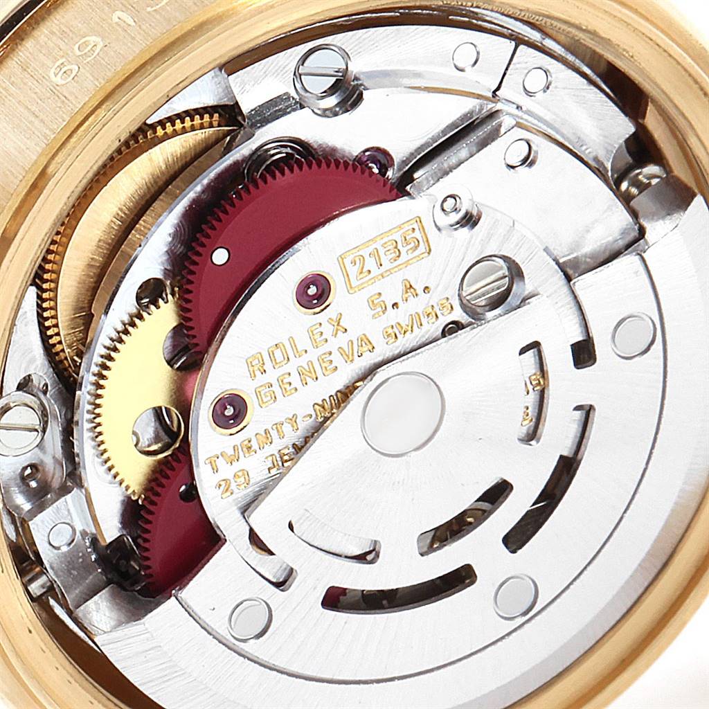 This image shows a close-up of the movement mechanism of a Rolex President 69138 Women's Yellow Gold Blue Dial 69138 Women's Yellow Gold Blue Dial model watch.