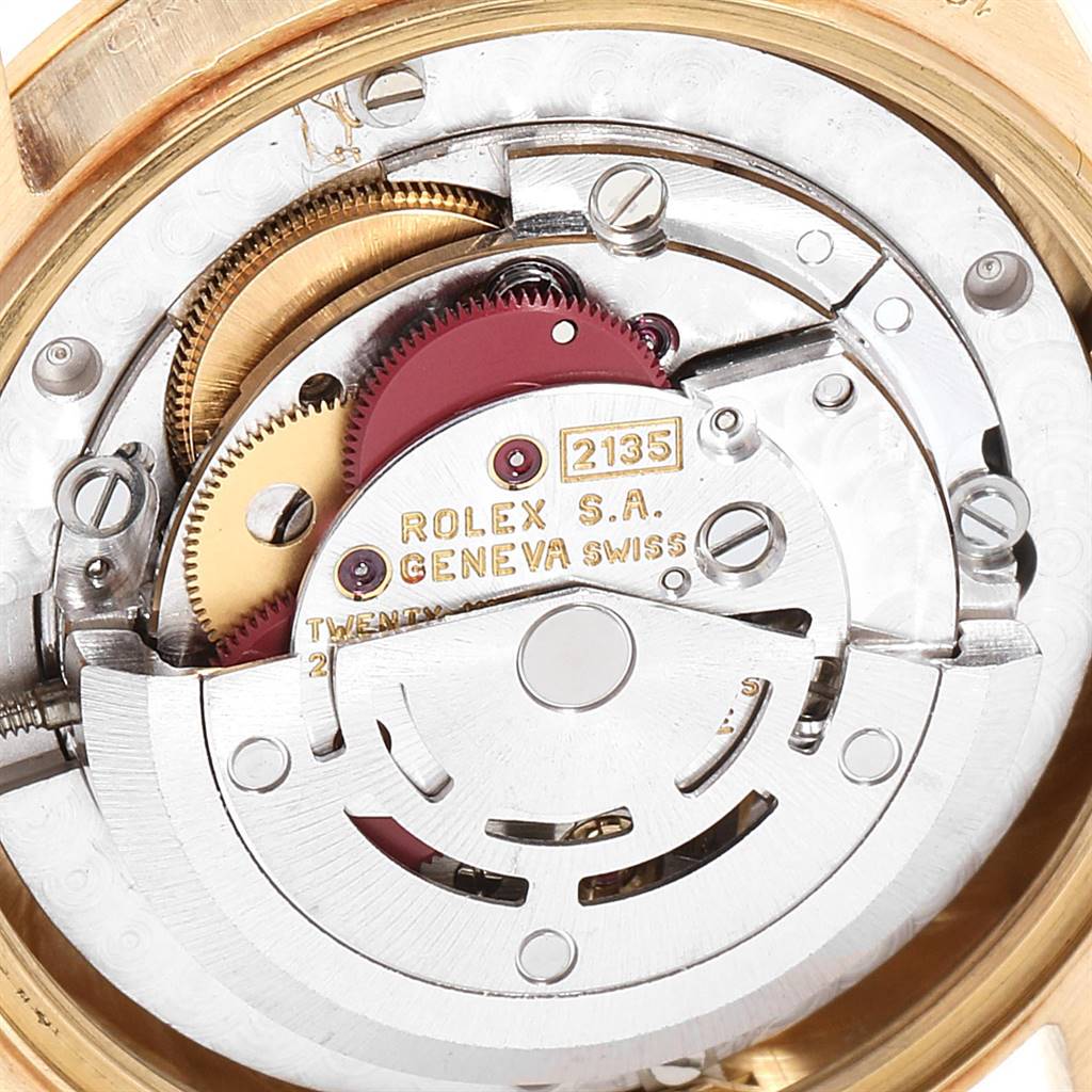 This image shows a close-up view of the movement mechanism inside a Rolex President 68278 Women's Yellow Gold White Dial 68278 Women's Yellow Gold White Dial watch, highlighting its gears and components.