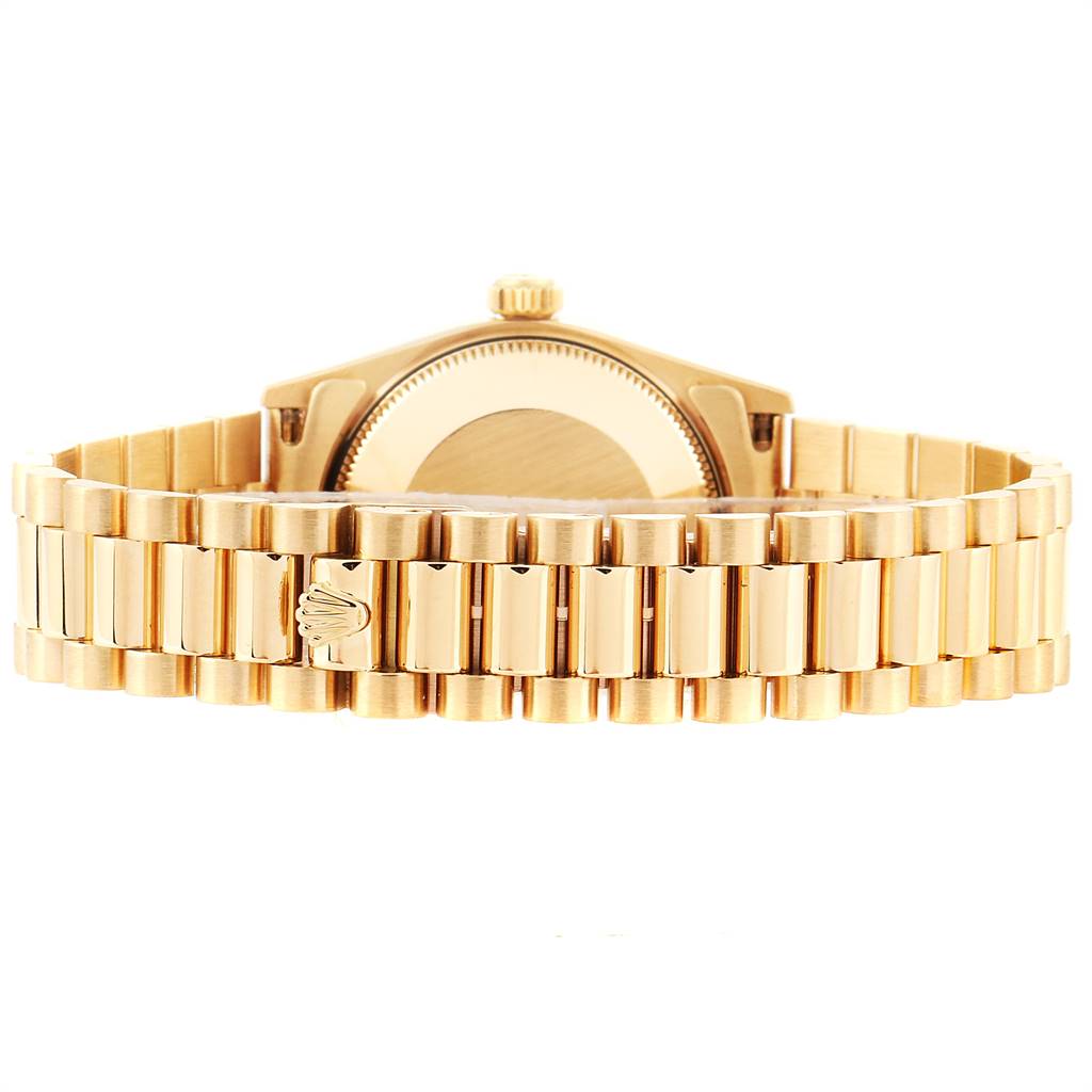 The image shows the back view of a Rolex President 68278 Women's Yellow Gold White Dial 68278 Women's Yellow Gold White Dial model watch, highlighting its gold bracelet and clasp.