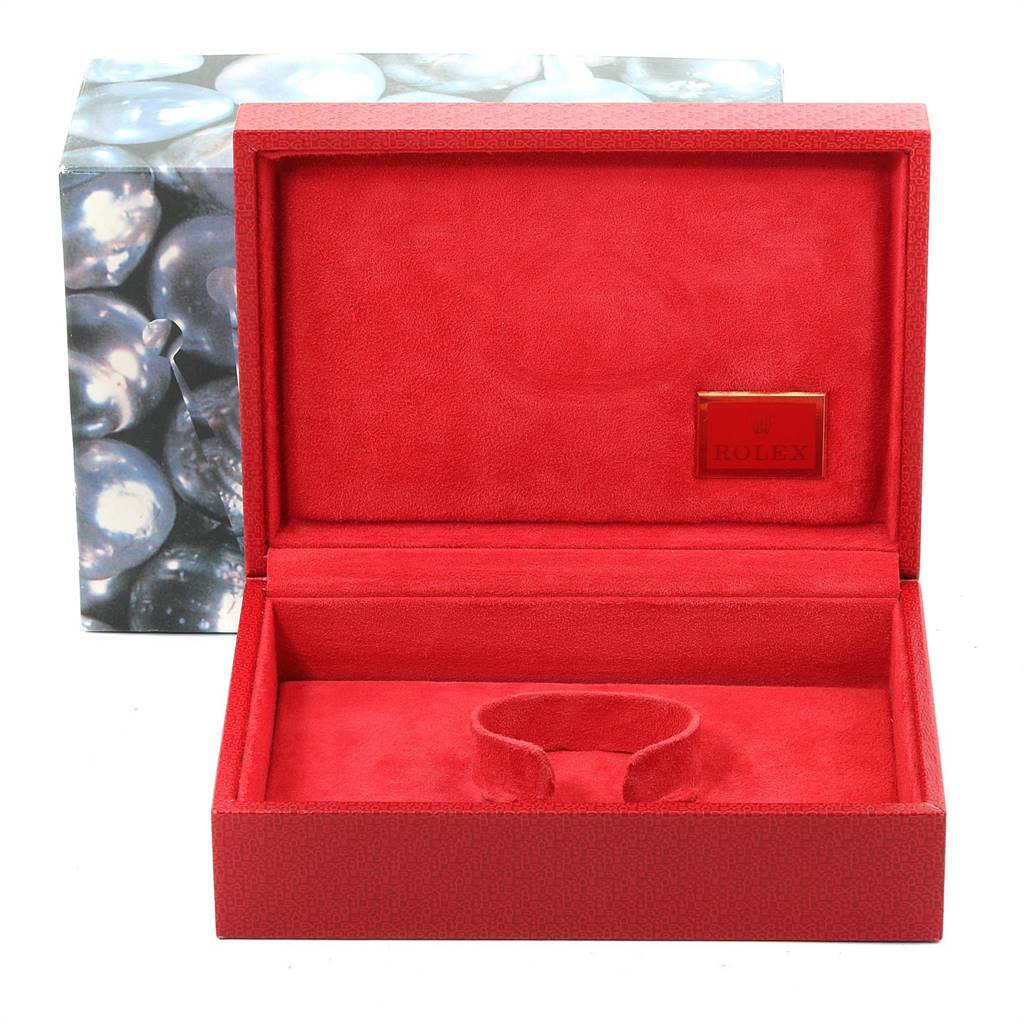 The image shows an open red Rolex President 69038 Women
s Yellow Gold Champagne Dial 69038 Women
s Yellow Gold Champagne Dial model watch box, including a holder and a "Rolex" plaque inside.