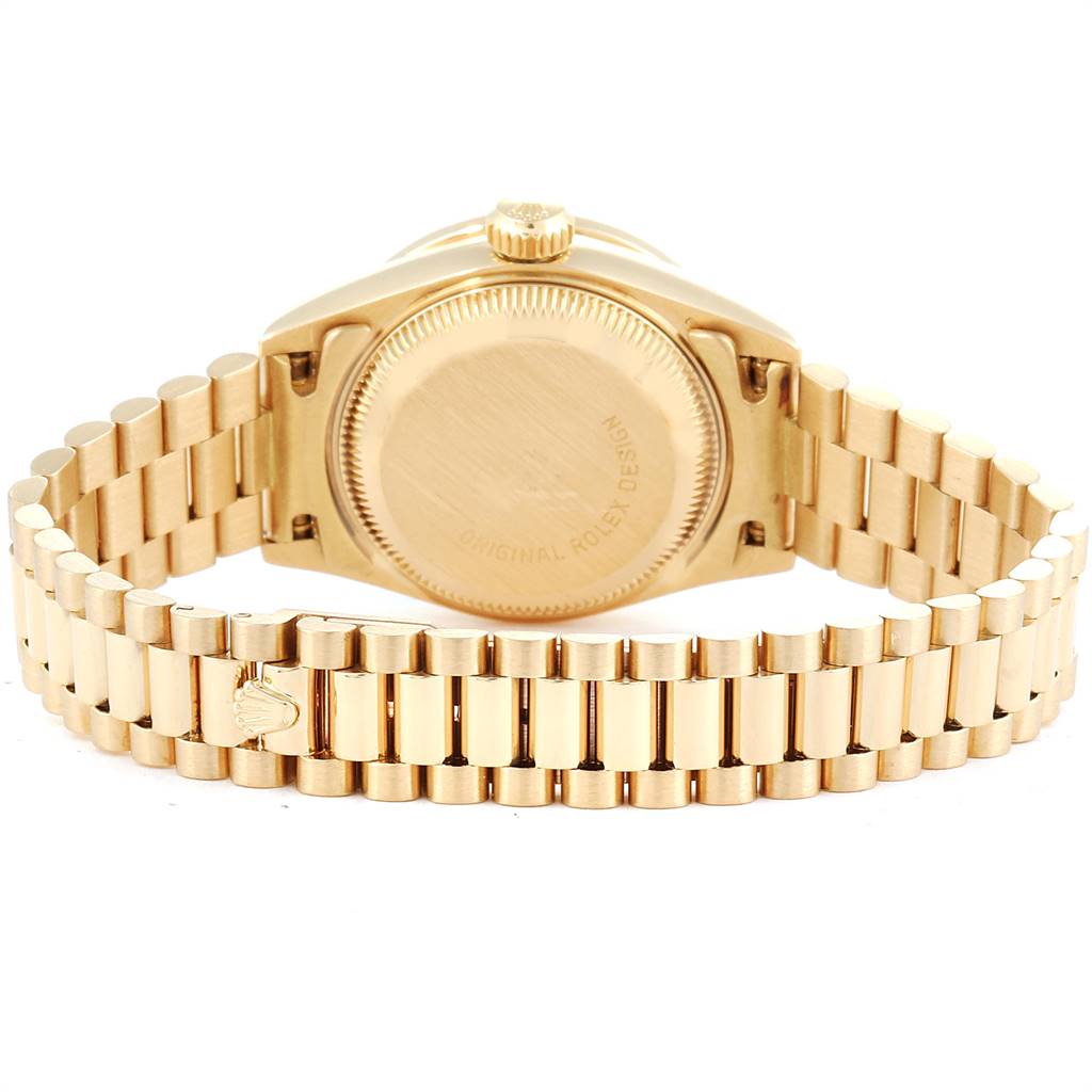 The image shows the backside and bracelet of the Rolex President 69038 Women
s Yellow Gold Champagne Dial 69038 Women
s Yellow Gold Champagne Dial model watch in gold.