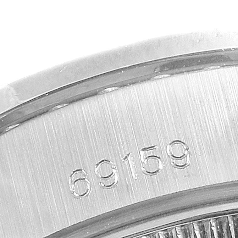 The image shows a close-up of the model number "69159" engraved on the case of a Rolex President 69159 Women's White Gold White Dial 69159 Women's White Gold White Dial watch.