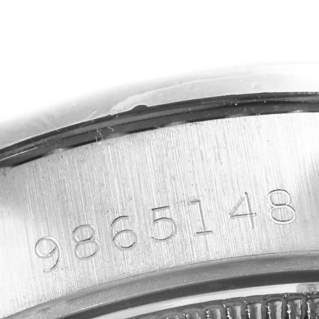 This image shows a partial view of the case back serial number for the Rolex President 69159 Women's White Gold White Dial 69159 Women's White Gold White Dial model watch.