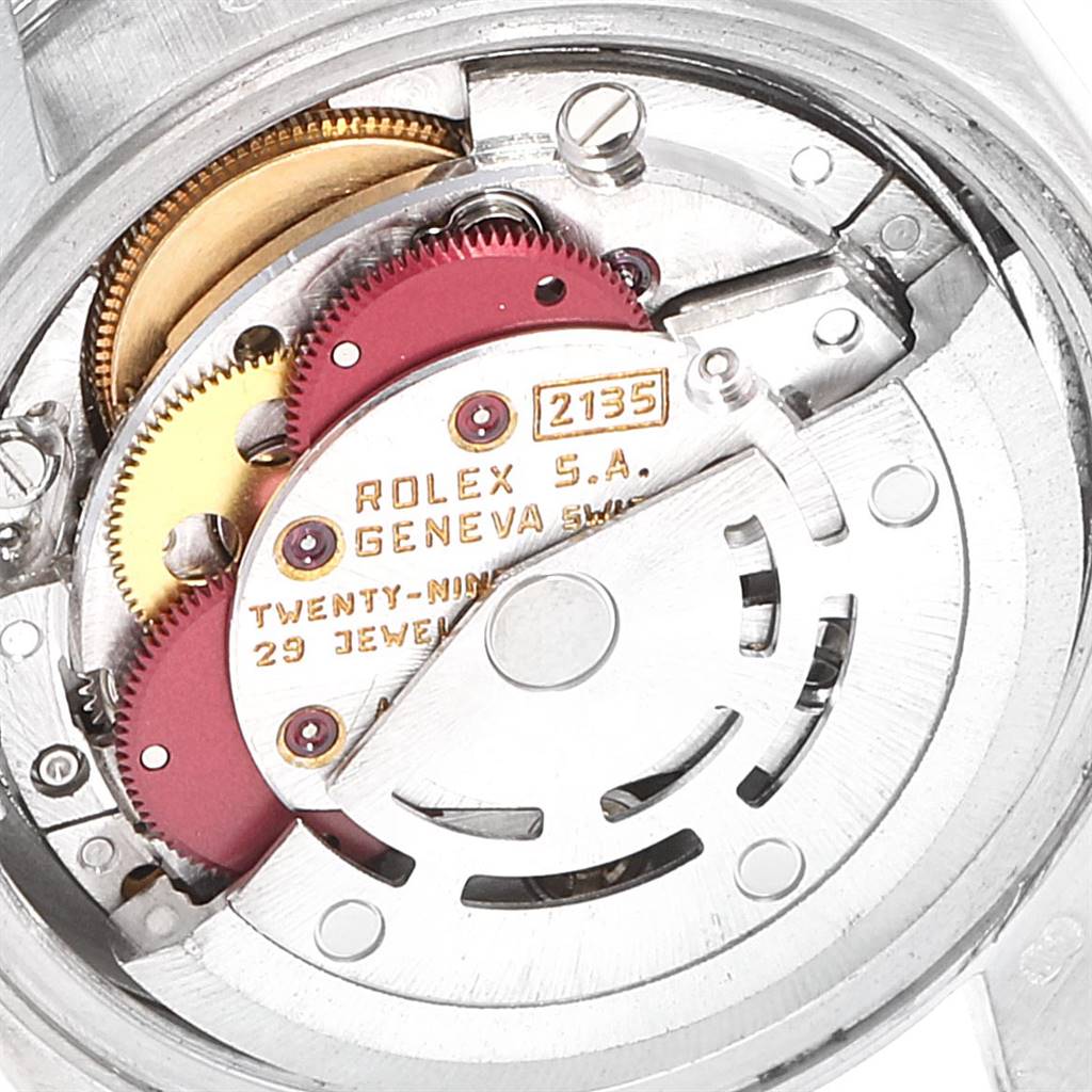 The image shows an internal view of the Rolex President 69159 Women's White Gold White Dial 69159 Women's White Gold White Dial model watch, highlighting its movement mechanism and gears.