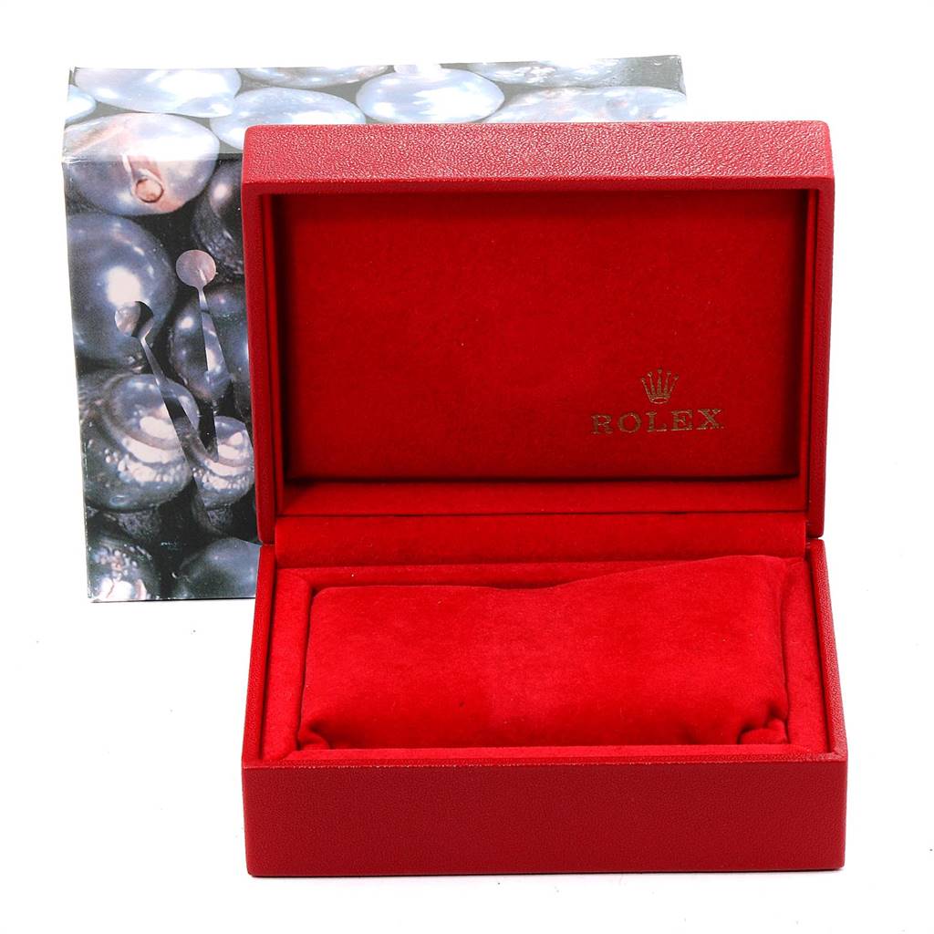 This image shows an open red Rolex President 69159 Women's White Gold White Dial 69159 Women's White Gold White Dial watch box with a cushion inside, viewed from the front angle.
