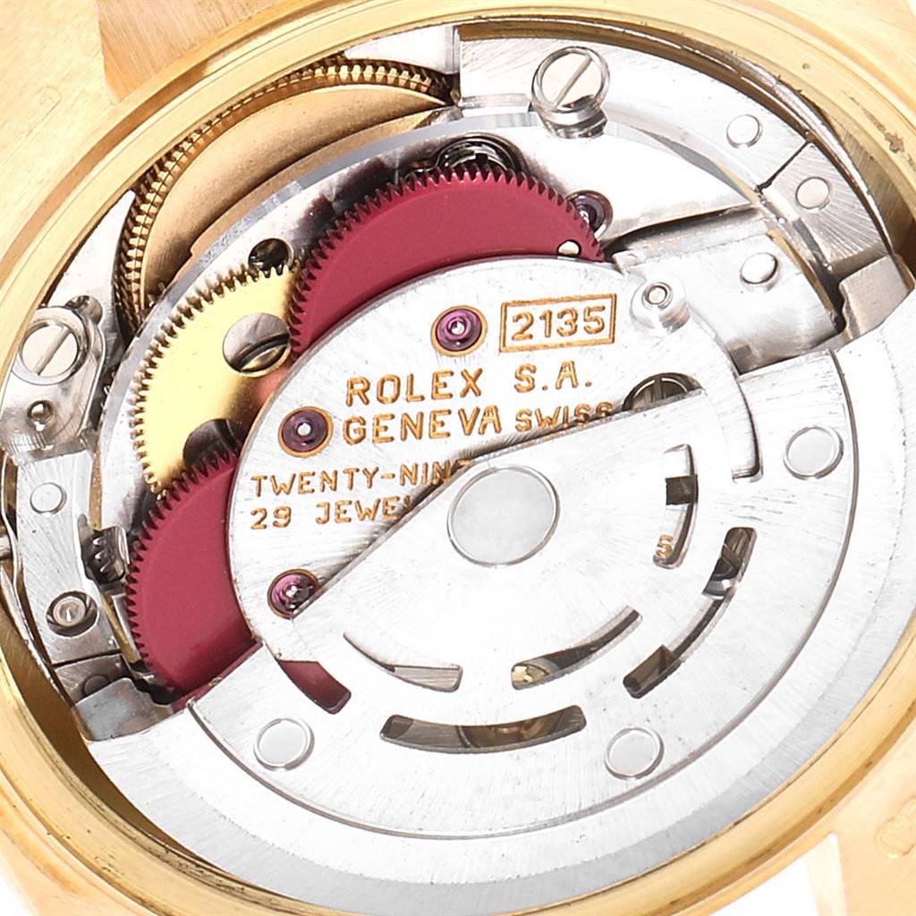 This image shows the internal components of a Rolex President 69158 Women's Yellow Gold Blue Dial 69158 Women's Yellow Gold Blue Dial model watch, including gears and a rotor, viewed from the back.