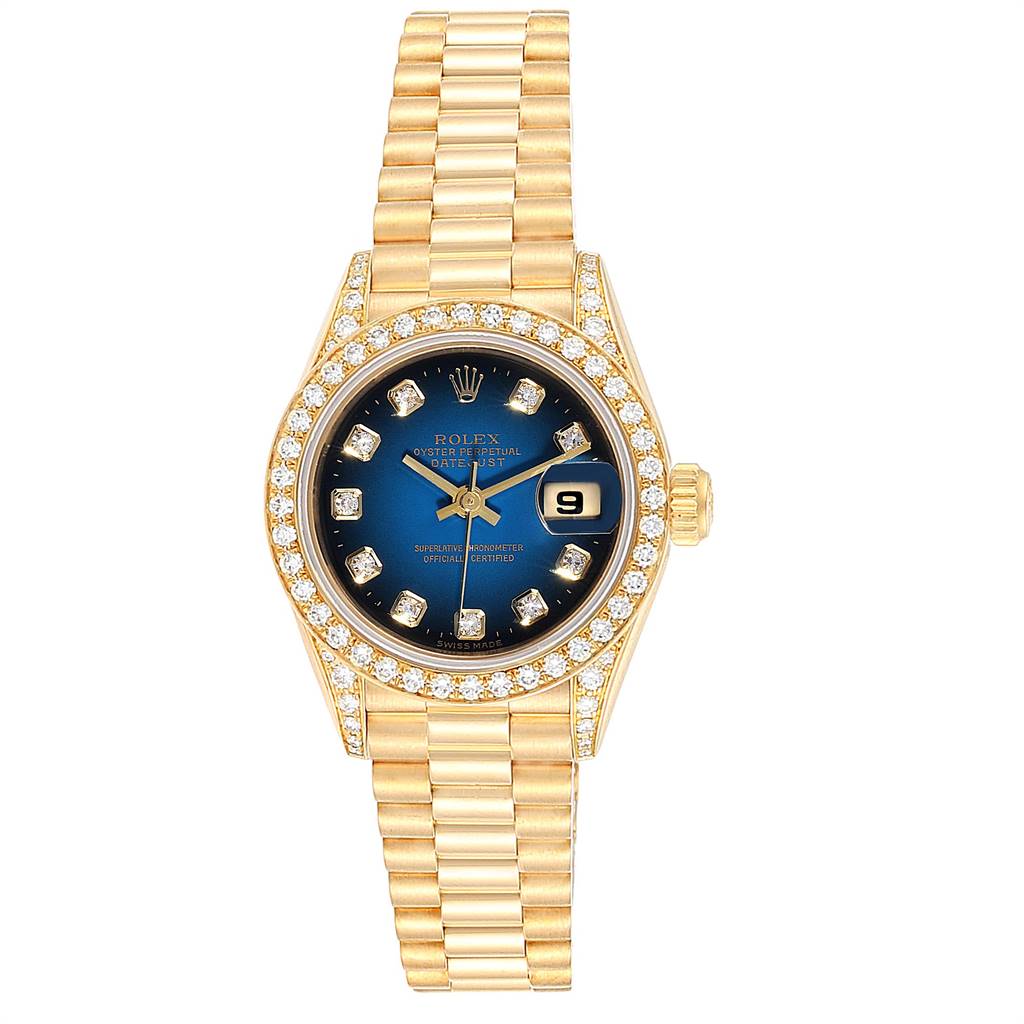 The image shows a front view of a Rolex President 69158 Women's Yellow Gold Blue Dial 69158 Women's Yellow Gold Blue Dial model watch with a gold band, blue dial, and diamond-encrusted bezel.