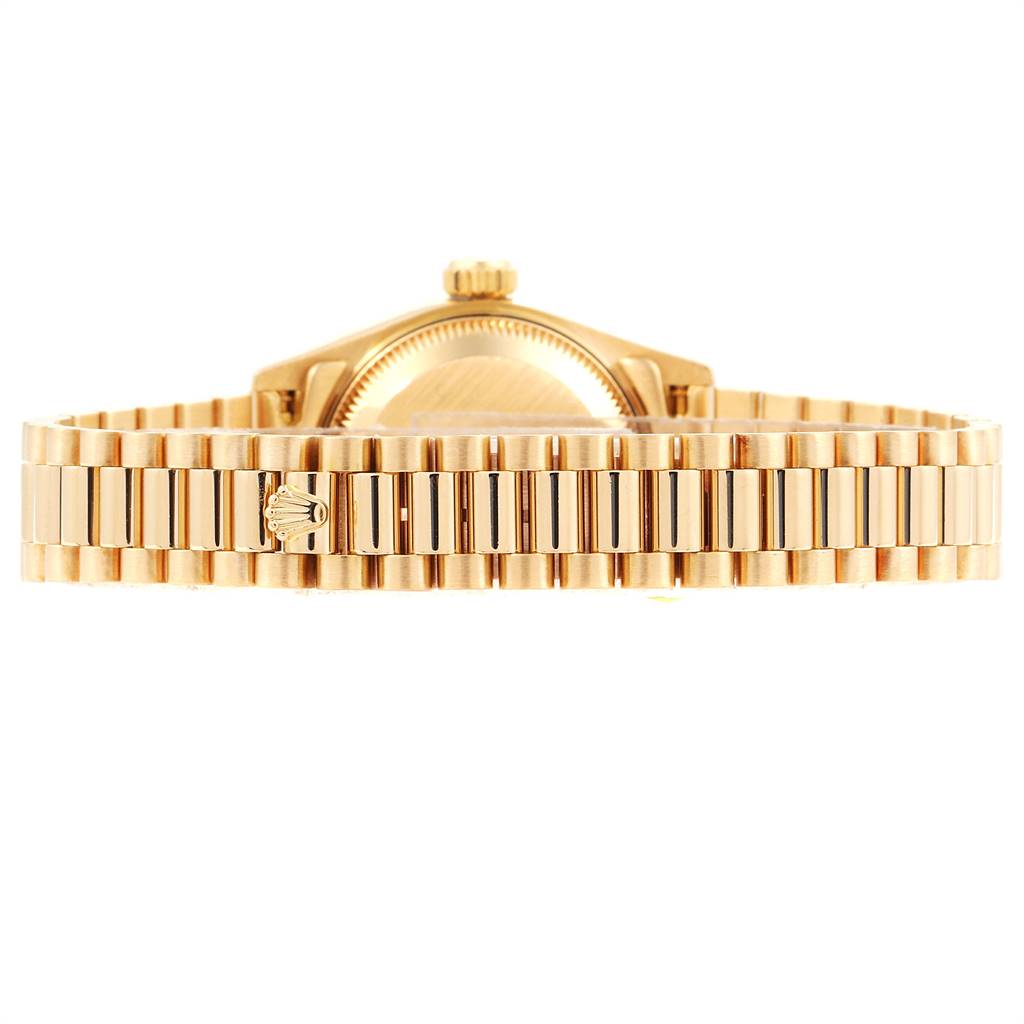 The Rolex President 69158 Women's Yellow Gold Blue Dial 69158 Women's Yellow Gold Blue Dial watch model is shown from the side, focusing on the bracelet and the back of the case.