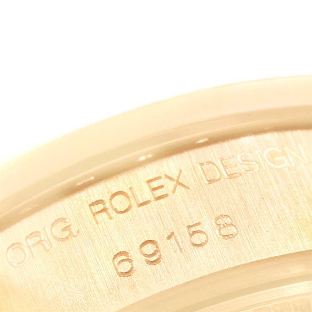 This close-up image shows the model number "69158" and the text "ORIG. ROLEX DESIGN" on the Rolex President 69158 Women's Yellow Gold Blue Dial 69158 Women's Yellow Gold Blue Dial watch.