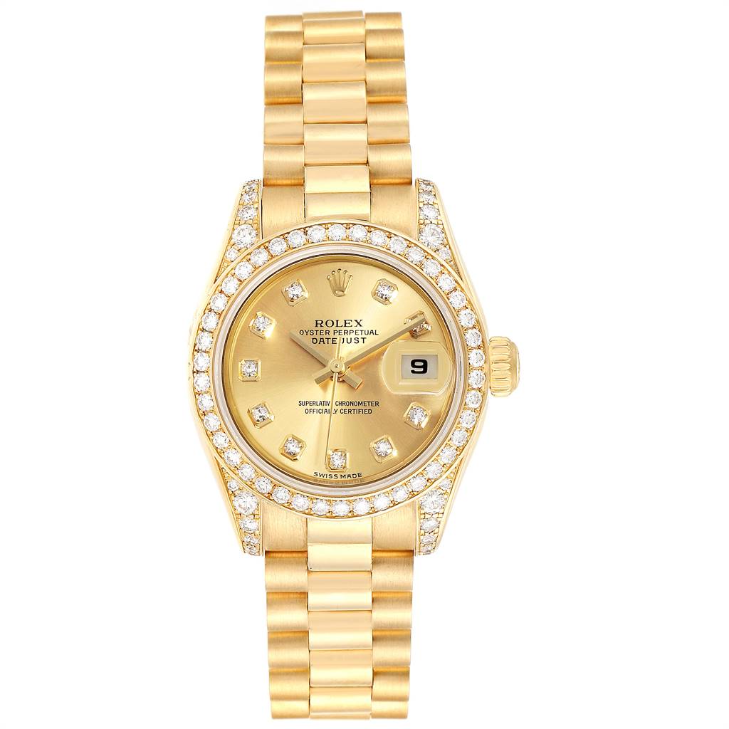 The Rolex President 179158 Women's Yellow Gold Champagne Dial 179158 Women's Yellow Gold Champagne Dial model watch is shown from a top-down angle, displaying its bejeweled bezel, gold dial, and metal bracelet.