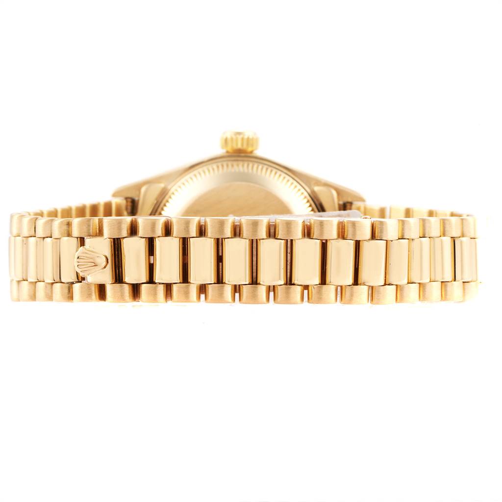 This image shows the side view of a Rolex President 69158 Women's Yellow Gold Champagne Dial 69158 Women's Yellow Gold Champagne Dial model watch, highlighting the bracelet and crown.
