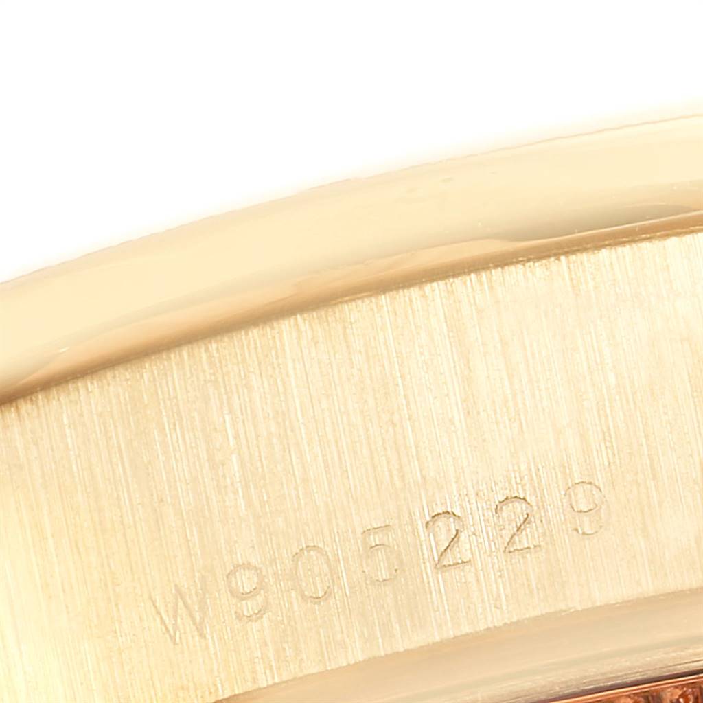 This image shows a close-up view of the serial number engraved on the case side of a Rolex President 69288 Women
s Yellow Gold White Dial 69288 Women
s Yellow Gold White Dial model watch.