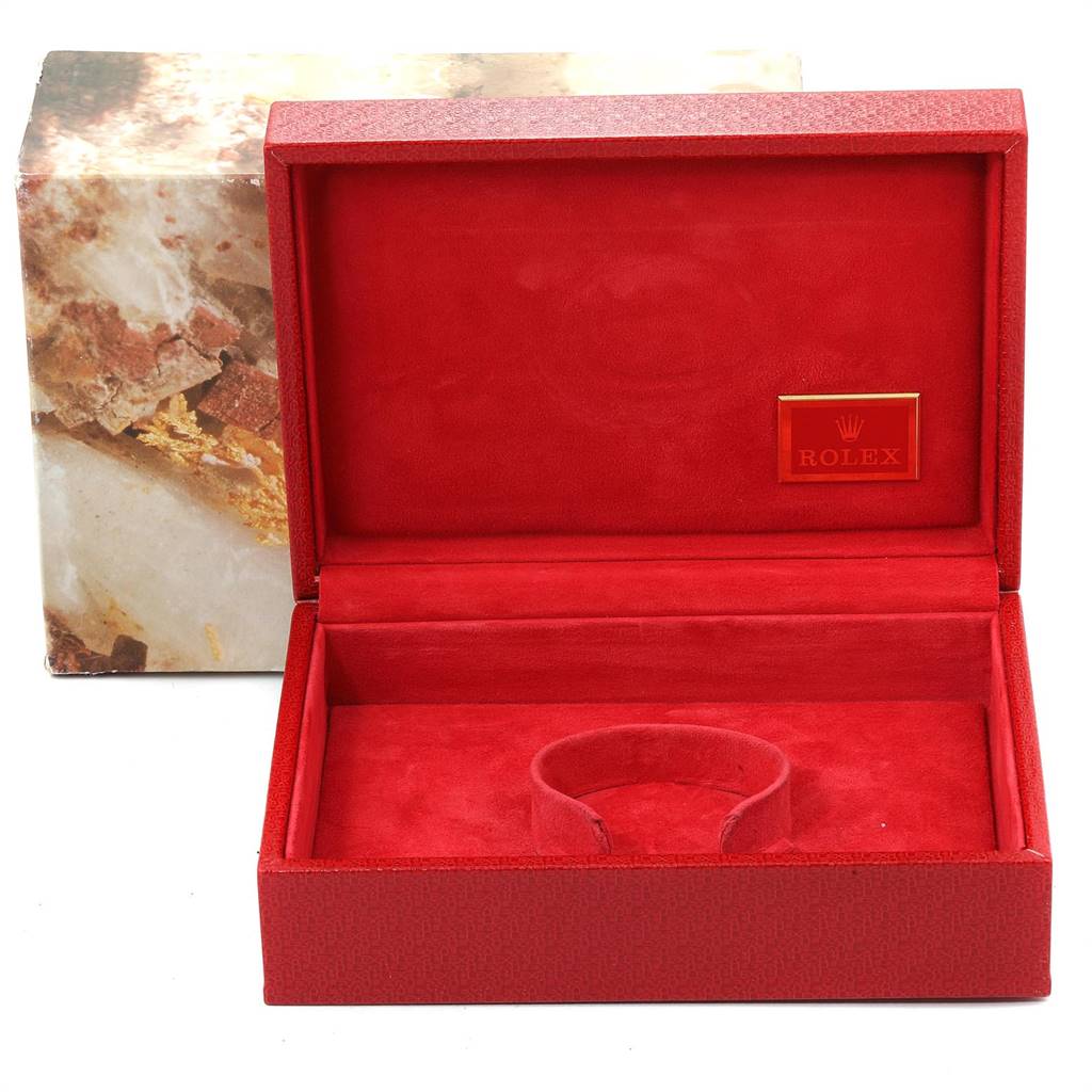 This image shows an open red Rolex watch box for the President model, displaying the interior and the brand logo.