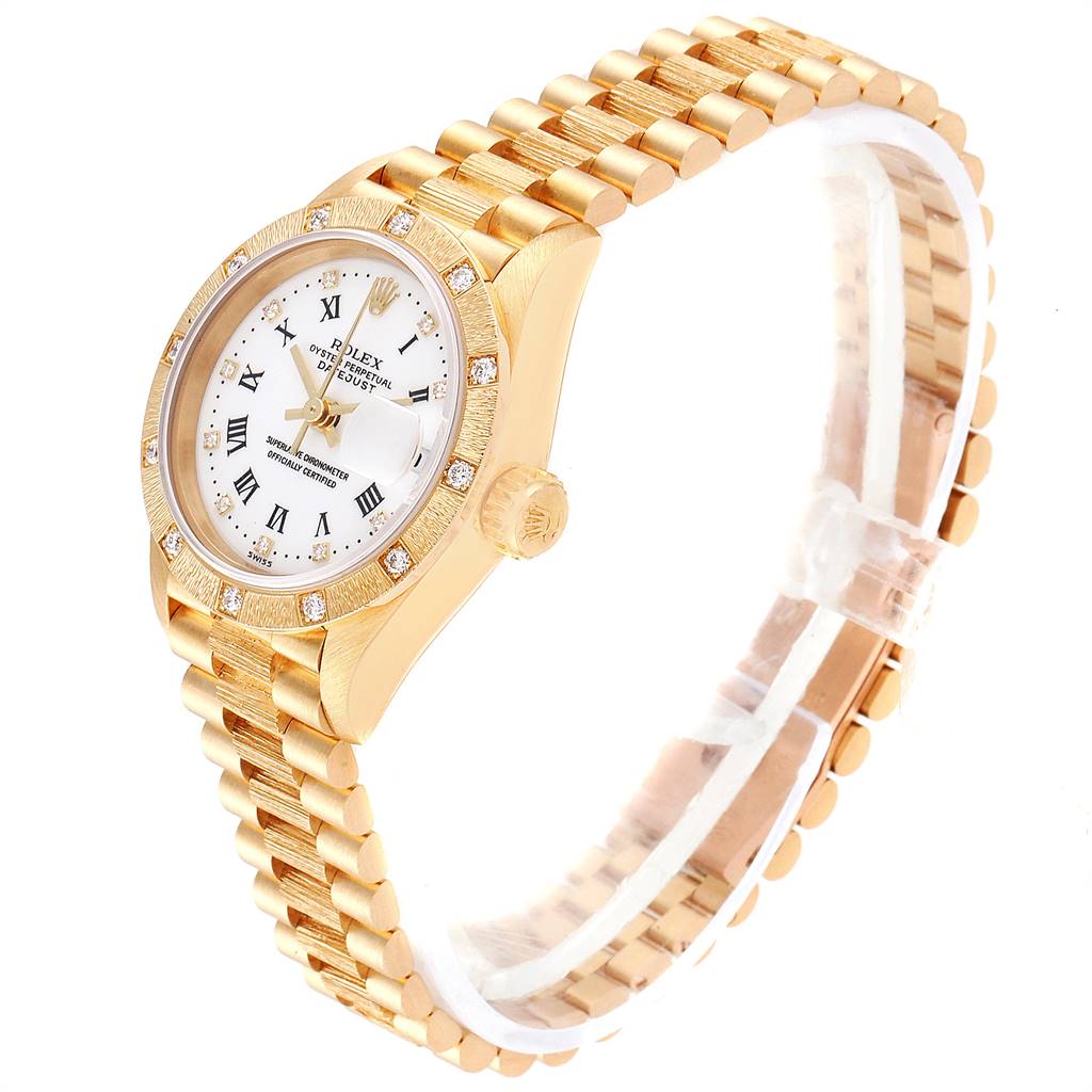 The image shows a side and top view of the Rolex President 69288 Women
s Yellow Gold White Dial 69288 Women
s Yellow Gold White Dial model watch, highlighting its gold band, bezel, and white dial.