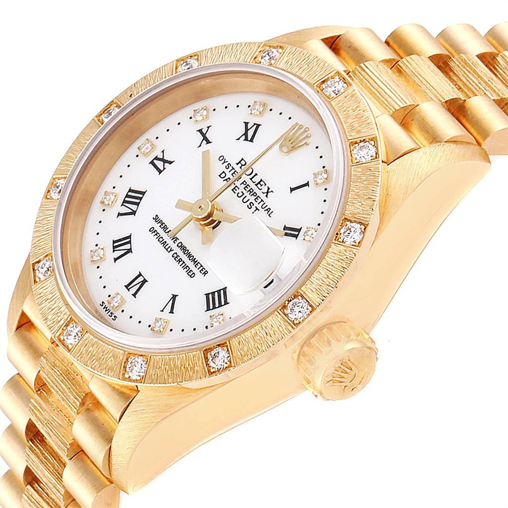 The image shows a side view of the Rolex President 69288 Women
s Yellow Gold White Dial 69288 Women
s Yellow Gold White Dial watch, highlighting its gold case, diamond bezel, crown, and part of the bracelet.