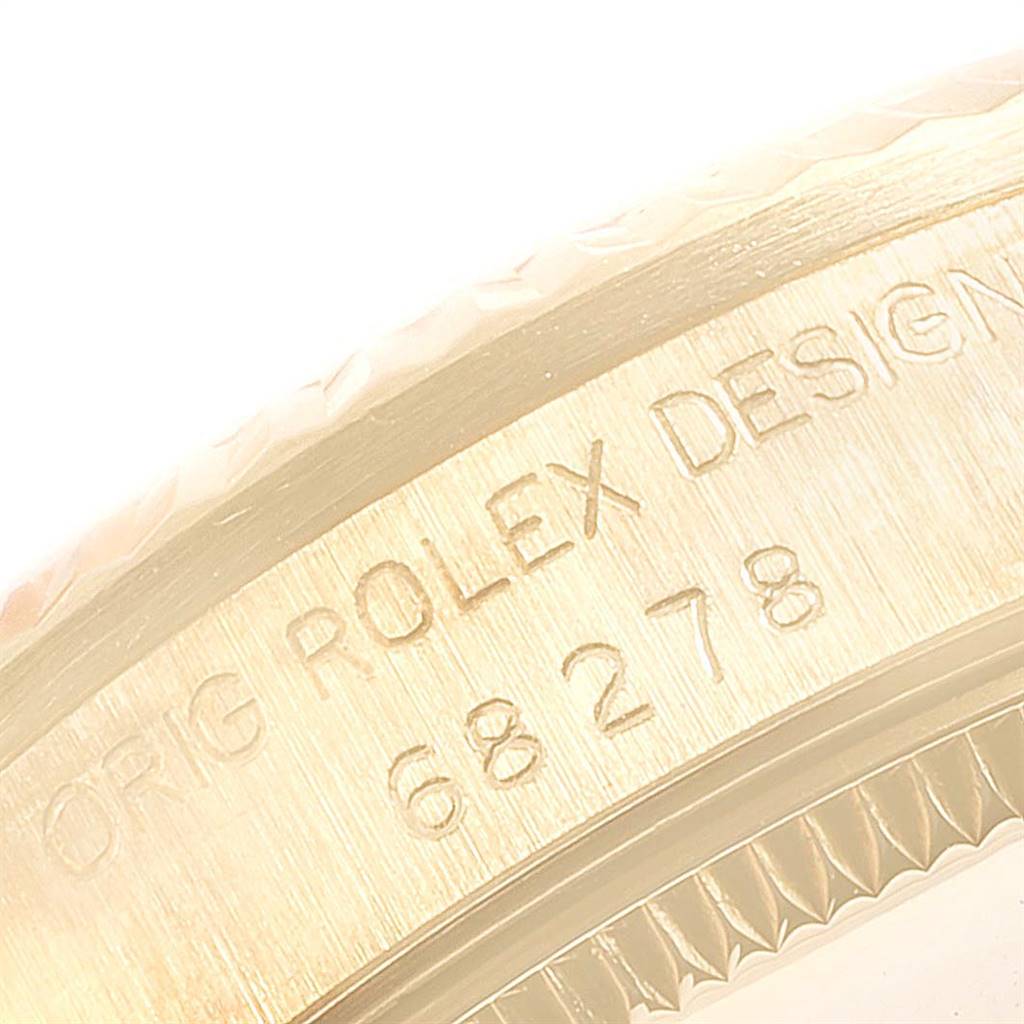This close-up image shows the engraved bezel of the Rolex President 68278 Women
s Yellow Gold Champagne Dial 68278 Women
s Yellow Gold Champagne Dial model watch.