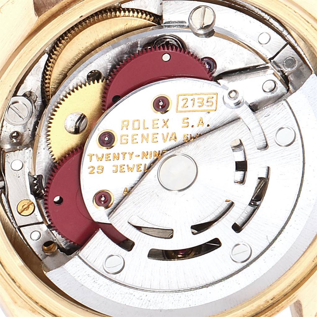 This image shows the inner mechanical movement of the Rolex President 69178 Women's Yellow Gold Blue Dial 69178 Women's Yellow Gold Blue Dial model watch, highlighting its intricate gears and components.