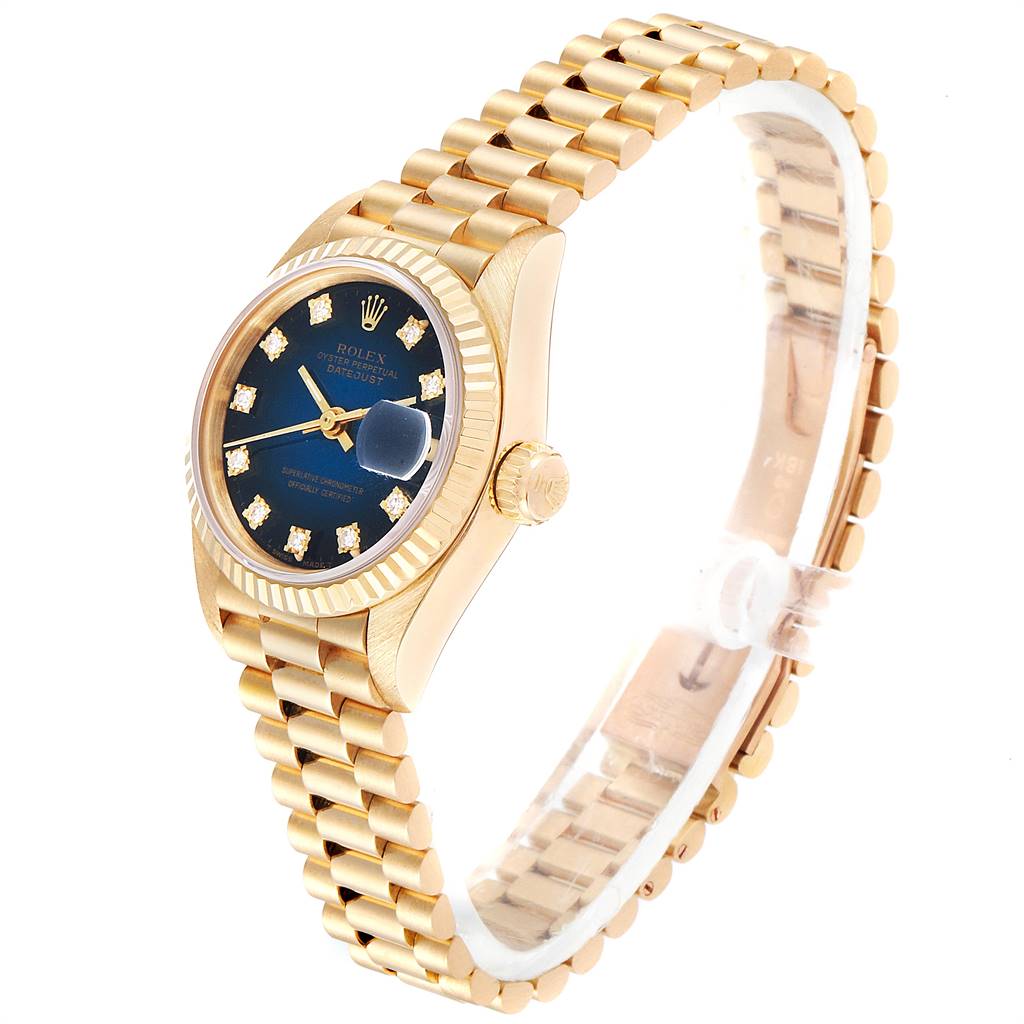 The Rolex President 69178 Women's Yellow Gold Blue Dial 69178 Women's Yellow Gold Blue Dial watch model is shown at a slight angle displaying its gold bracelet, blue dial, and bejeweled hour markers.