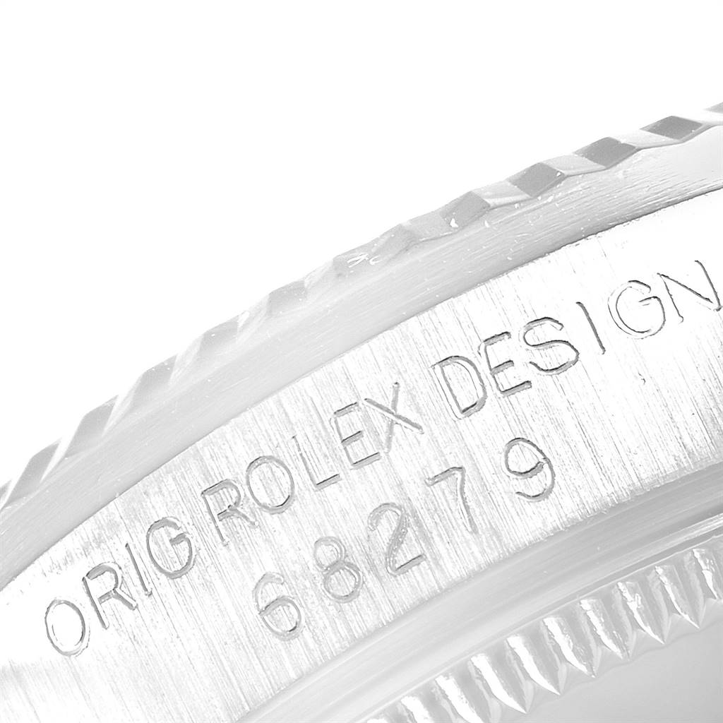 This image shows a close-up of the serial number engraving on the bezel of a Rolex President 68279 Women's White Gold Silver Dial 68279 Women's White Gold Silver Dial model watch.