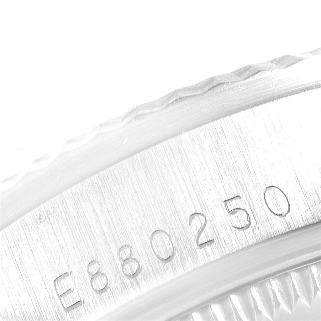 The image shows a close-up of the serial number engraving on the bezel edge of a Rolex President 68279 Women's White Gold Silver Dial 68279 Women's White Gold Silver Dial model watch.