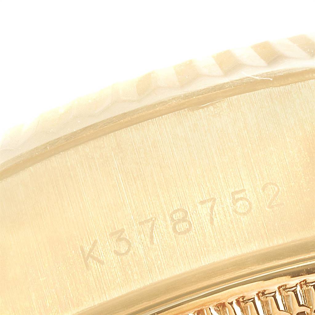 The image shows a close-up of the serial number and part of the fluted bezel on a Rolex President 79178 Women
s Yellow Gold Champagne Dial 79178 Women
s Yellow Gold Champagne Dial model watch.