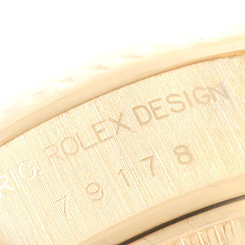 The image shows a close-up of the engraved text on the case back of a Rolex President 79178 Women
s Yellow Gold Champagne Dial 79178 Women
s Yellow Gold Champagne Dial model watch.