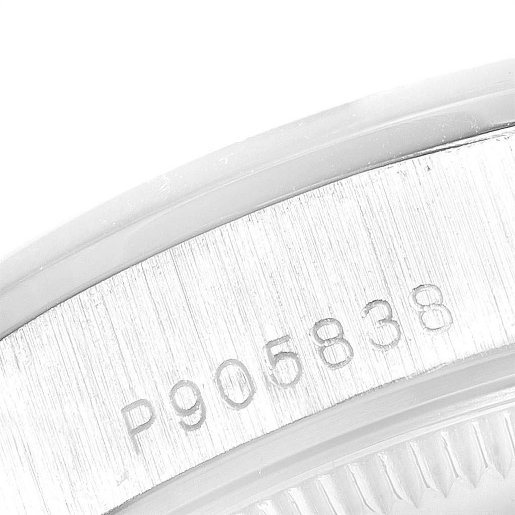 This close-up shows the engraved serial number on the case side of a Rolex President 78246 Women's Platinum Silver Dial 78246 Women's Platinum Silver Dial model.