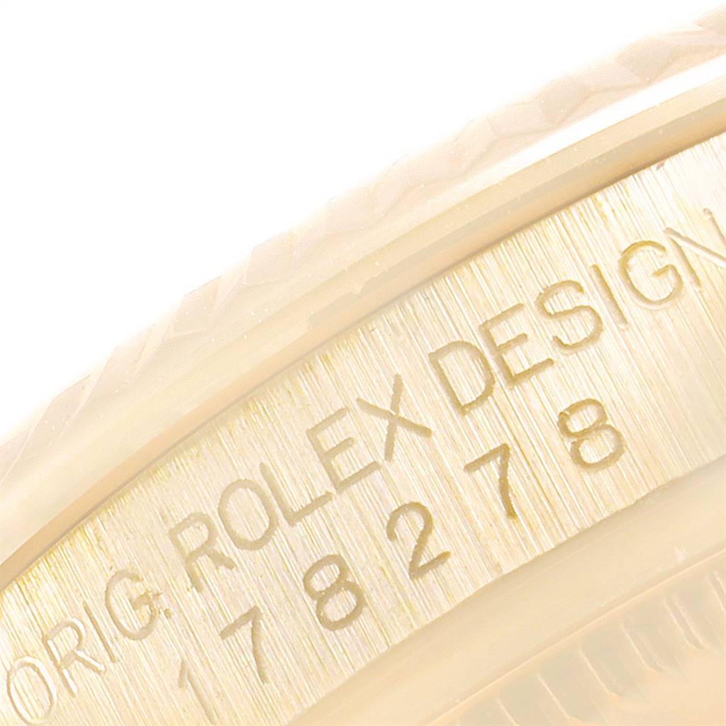 This close-up image shows the engraved inner bezel of a Rolex President 178278 Women
s Yellow Gold Mother of Pearl Dial 178278 Women
s Yellow Gold Mother of Pearl Dial model watch, featuring the model and brand name.