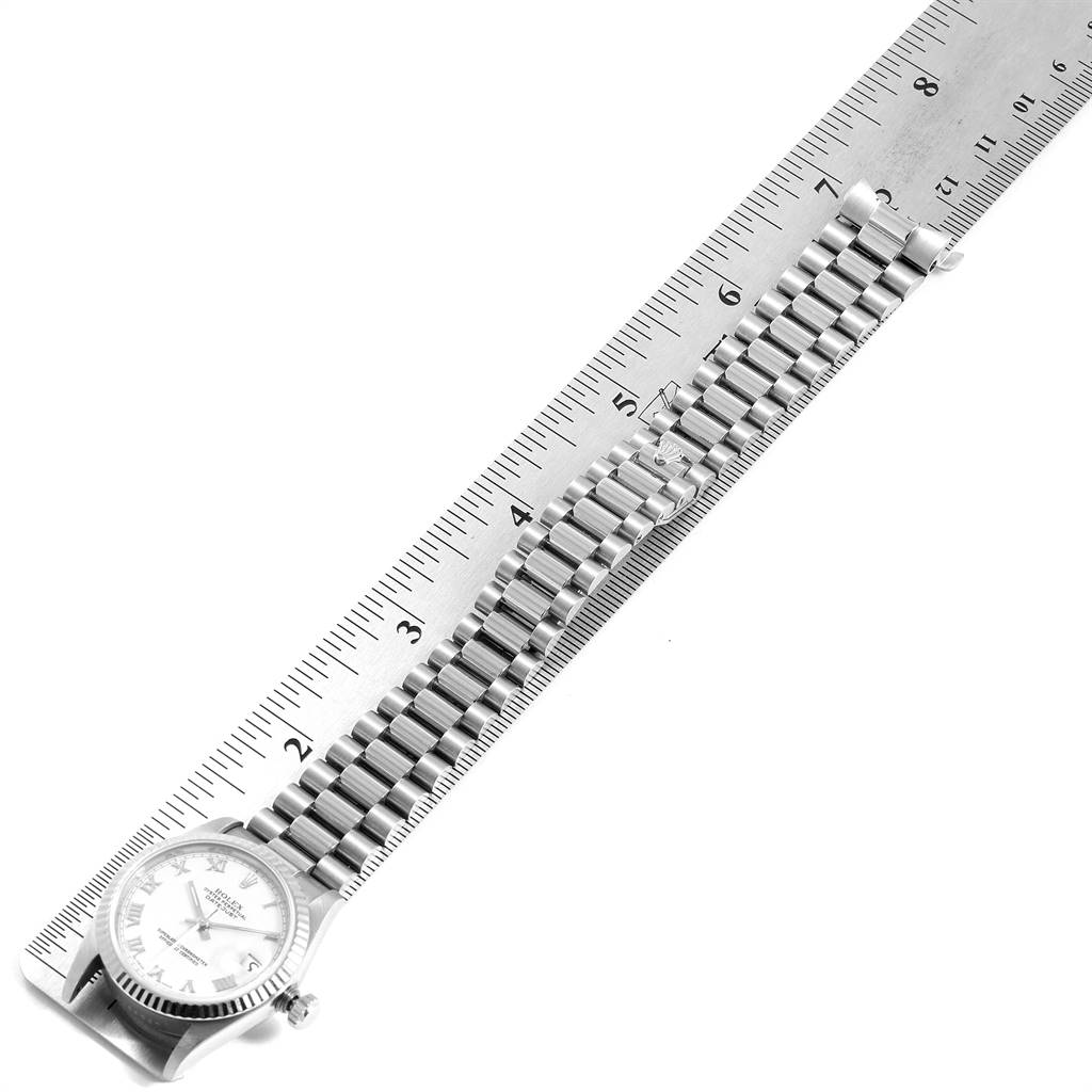 The Rolex President 68279 Women's White Gold White Dial 68279 Women's White Gold White Dial model watch is shown from a top-down angle, aligned with a ruler for measurement.